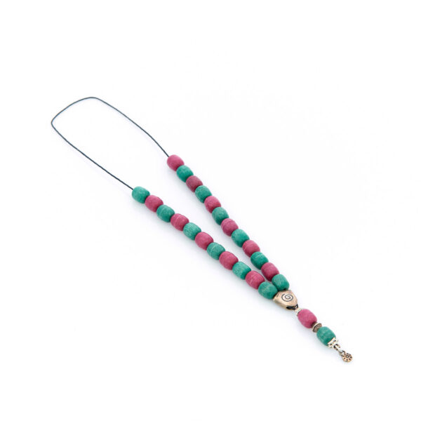 handmade worry bead from livani in green and red shades