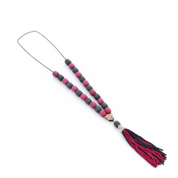 handmade worry bead from incense in black and red shades.