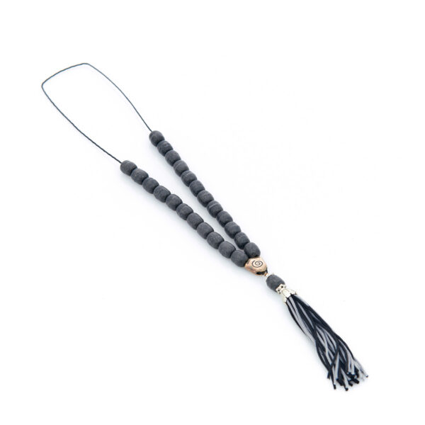 handmade worry bead from livani in black shades with a tassel