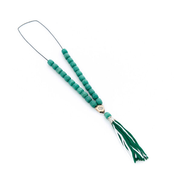 handmade worry bead from incense in green shades with a tassel