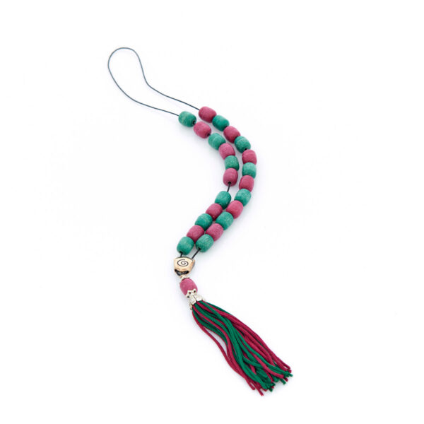 handmade worry bead from livani in green and red shades with a tassel