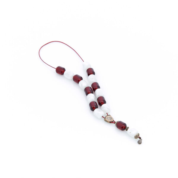 from the center of kompoloi, handmade resin worry bead in crimson and white