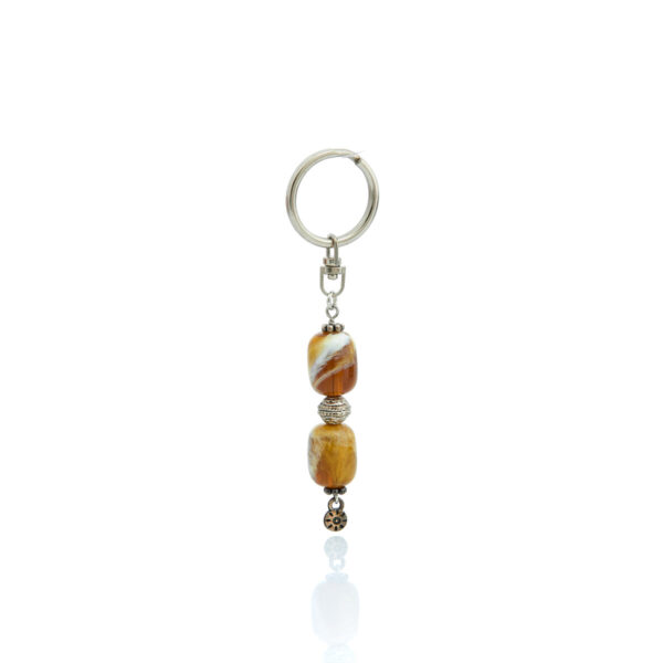 brown resin keychain with details