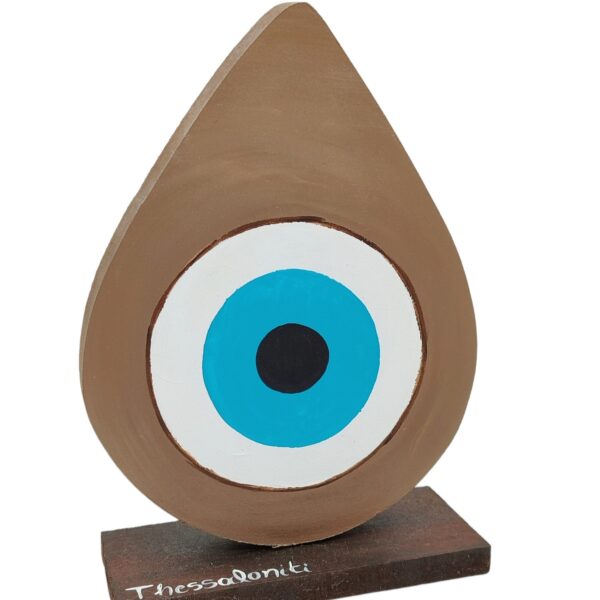 handmade wooden brown eye in the shape of a teardrop